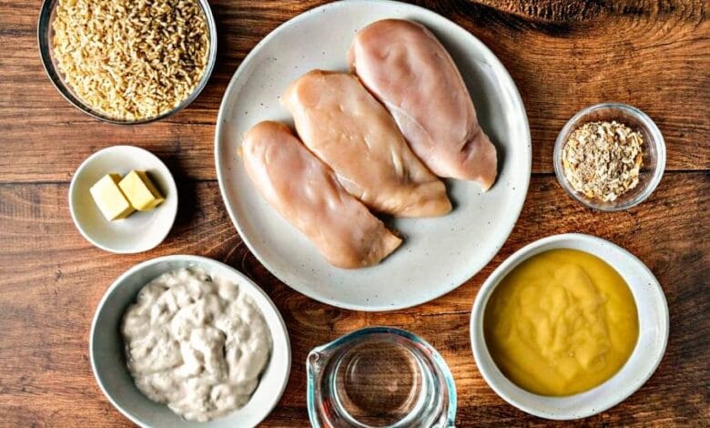 The golden-brown chicken breasts rest atop a bed of fluffy