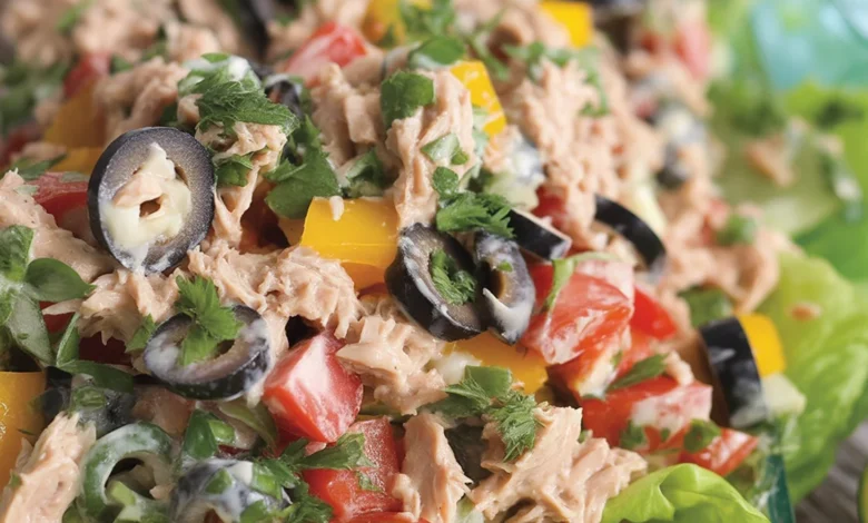 Delicious Italian tuna fish salad with olives, lemon, and fresh vegetables.